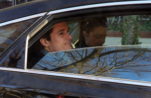 Orlando Bloom and Miranda Kerr ride in the backseat together after a doctor's visit