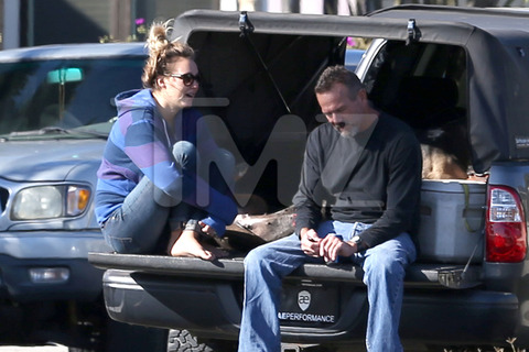 EXCLUSIVE: Jasmine Pilchard-Gosnell chats with friends outside Paul Walker' home.