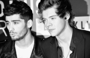 NEW YORK, NY - AUGUST 25: (EDITORS NOTE: Image has been converted to black and white.) Zayn Malik (L) and Harry Styles of One Direction attend the 2013 MTV Video Music Awards at the Barclays Center on August 25, 2013 in the Brooklyn borough of New York City.  (Photo by Stephen Lovekin/Getty Images for MTV)