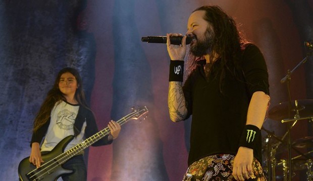 Korn's band Jonathan Davis (R) and  12-year-old Tye Trujillo, son of Metallica's bassist Robert Trujillo perform in Bogota on April 17, 2017, / AFP PHOTO / RAUL ARBOLEDA        (Photo credit should read RAUL ARBOLEDA/AFP/Getty Images)